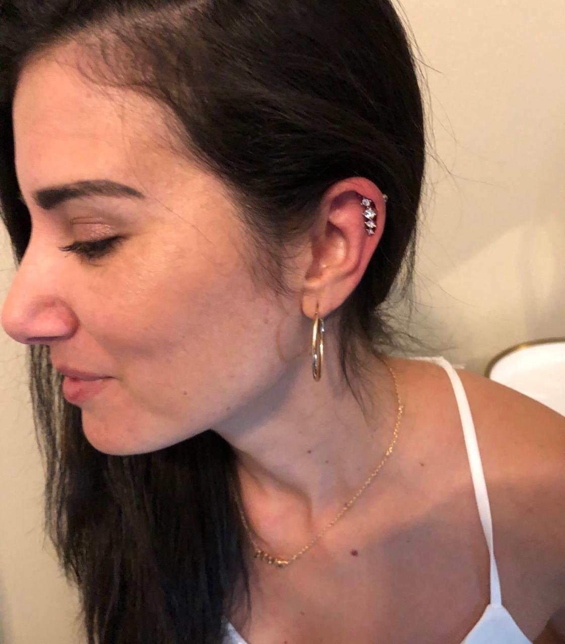 Trabalho de piercing do estúdio Paulinho Tattoo